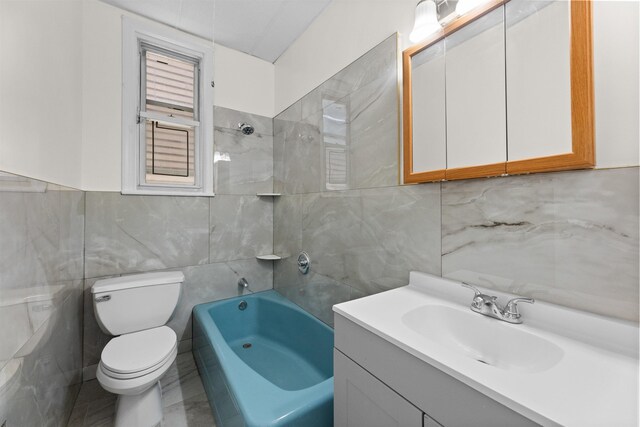 337 70th St, Guttenberg, NJ 07093 - bathroom with tile walls, toilet, vanity, shower / washtub combination, and backsplash