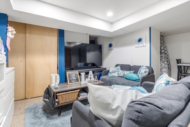 living area with recessed lighting and light tile patterned flooring