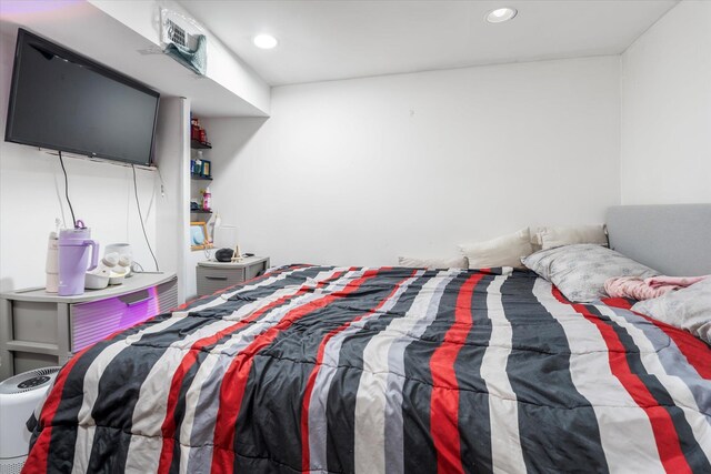 bedroom featuring recessed lighting