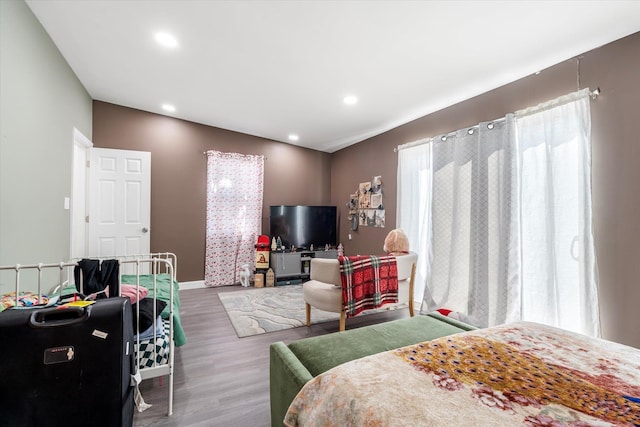 bedroom featuring recessed lighting, baseboards, and wood finished floors