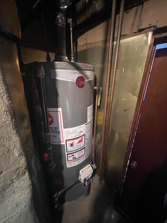 utility room featuring gas water heater