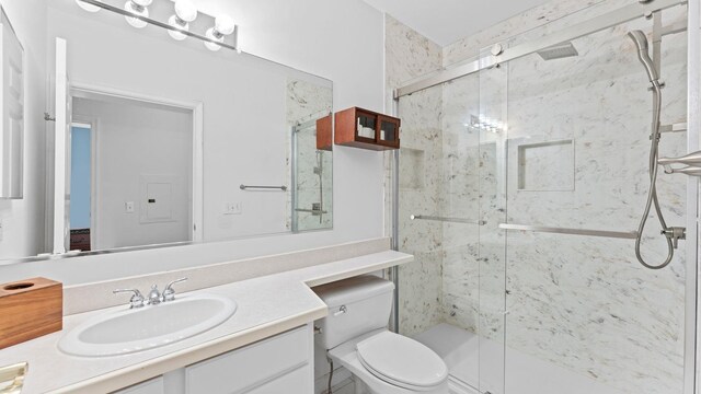 344 The Promenade Unit 344, Edgewater, NJ 07020 - bathroom featuring vanity, a marble finish shower, and toilet