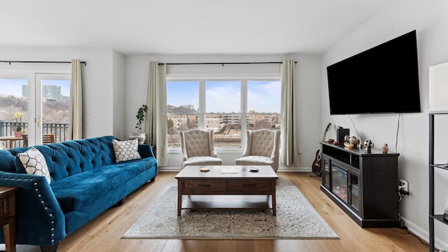 344 The Promenade Unit 344, Edgewater, NJ 07020 - living room featuring plenty of natural light and light wood-style flooring