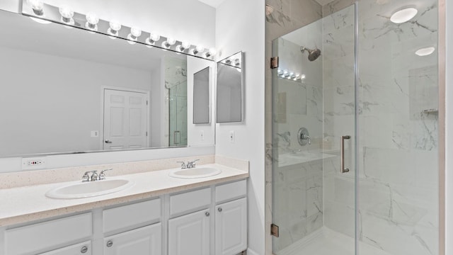 344 The Promenade Unit 344, Edgewater, NJ 07020 - bathroom with a sink, a marble finish shower, and double vanity