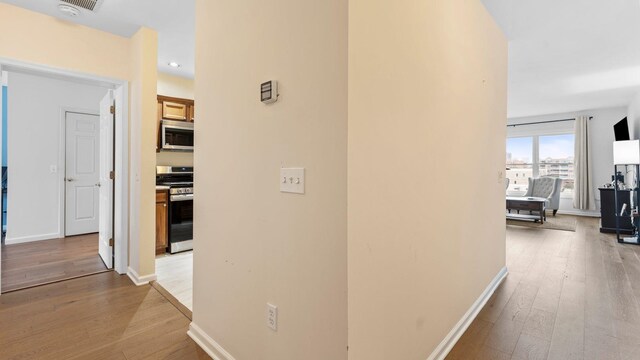 344 The Promenade Unit 344, Edgewater, NJ 07020 - corridor with recessed lighting, baseboards, and light wood-style floors