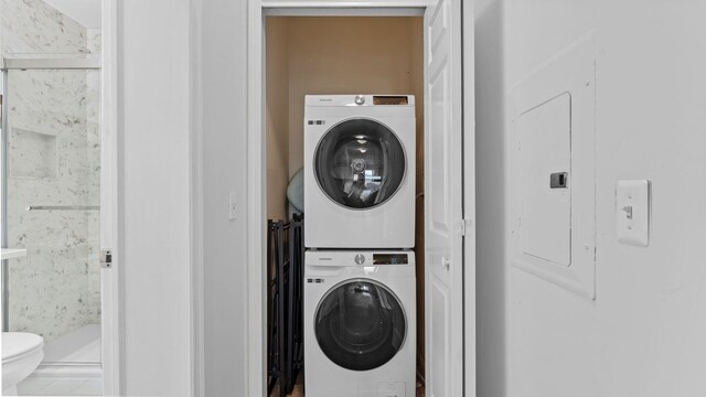 344 The Promenade Unit 344, Edgewater, NJ 07020 - washroom with laundry area, stacked washer and dryer, and tile patterned floors