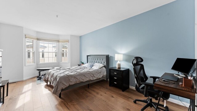 344 The Promenade Unit 344, Edgewater, NJ 07020 - bedroom with baseboards and wood finished floors