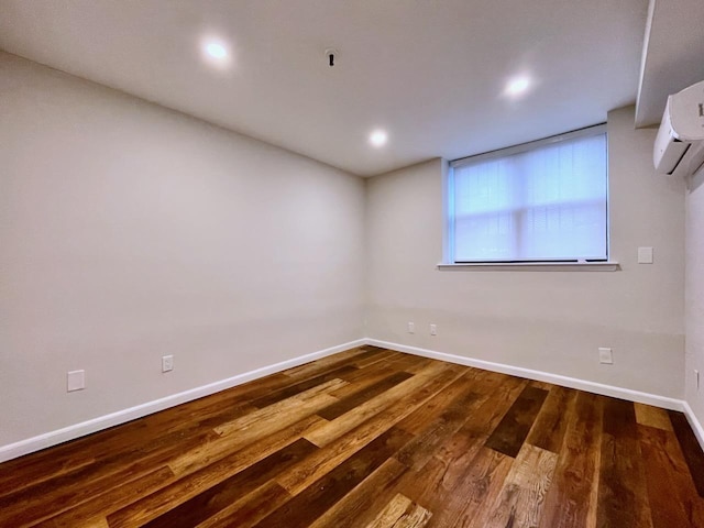 43 Van Wagenen Ave Unit Ga, Jersey City, NJ 07306 - empty room with wood finished floors, a wall mounted air conditioner, and recessed lighting
