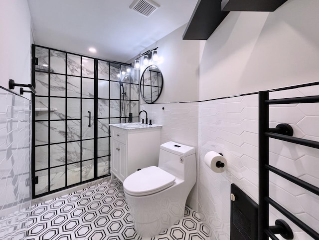 43 Van Wagenen Ave Unit Ga, Jersey City, NJ 07306 - full bathroom featuring tile walls, vanity, tiled shower, and tile patterned flooring