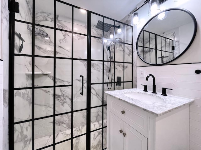 43 Van Wagenen Ave Unit Ga, Jersey City, NJ 07306 - bathroom featuring tile walls, vanity, and a stall shower