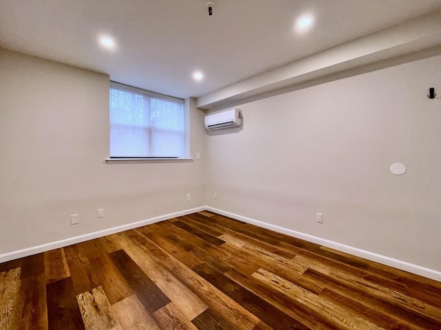 43 Van Wagenen Ave Unit Ga, Jersey City, NJ 07306 - basement with a wall mounted air conditioner, wood finished floors, and recessed lighting