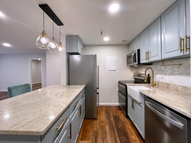 43 Van Wagenen Ave Unit Ga, Jersey City, NJ 07306 - kitchen with appliances with stainless steel finishes, gray cabinetry, dark wood-style floors, backsplash, and recessed lighting