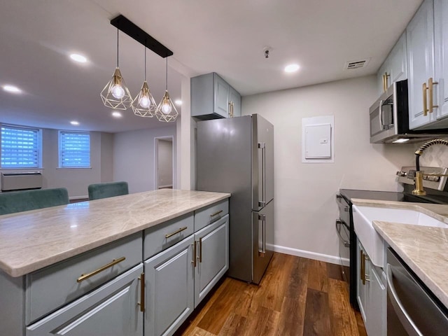43 Van Wagenen Ave Unit Ga, Jersey City, NJ 07306 - kitchen featuring gray cabinetry, appliances with stainless steel finishes, dark wood-style flooring, recessed lighting, and pendant lighting
