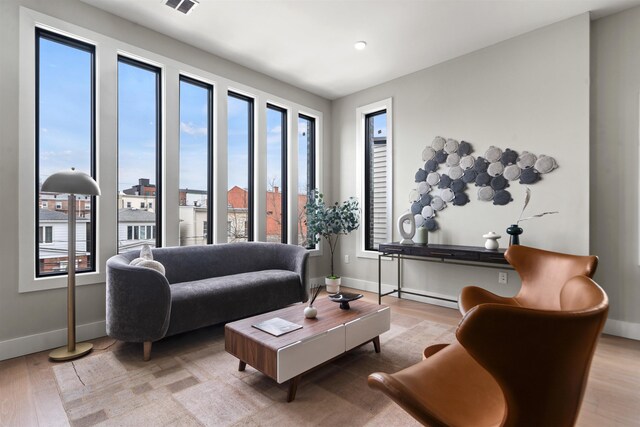 28 Cambridge Ave Unit 2, Jersey City, NJ 07307 - living room featuring baseboards, visible vents, and light wood-style flooring