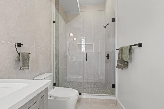28 Cambridge Ave Unit 2, Jersey City, NJ 07307 - full bathroom featuring a shower stall, tile patterned floors, toilet, and vanity