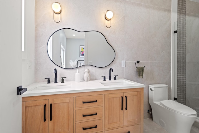 28 Cambridge Ave Unit 2, Jersey City, NJ 07307 - bathroom featuring tile walls, double vanity, a sink, and toilet