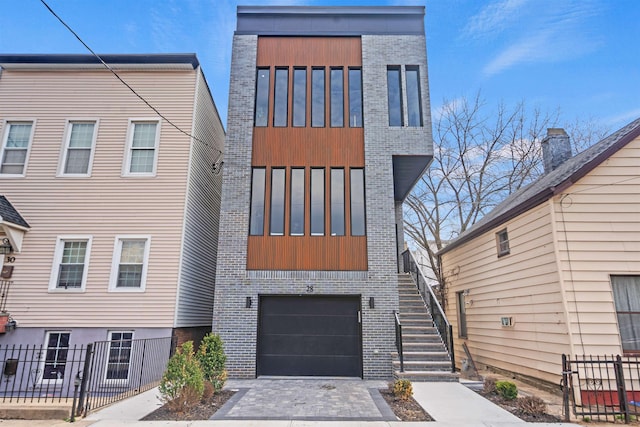 28 Cambridge Ave Unit 2, Jersey City, NJ 07307 - view of front of home featuring stairs, board and batten siding, and brick siding