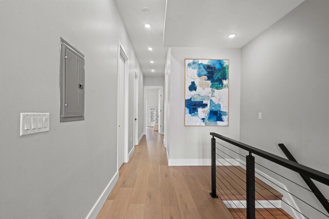 28 Cambridge Ave Unit 2, Jersey City, NJ 07307 - corridor featuring an upstairs landing, electric panel, light wood finished floors, baseboards, and recessed lighting