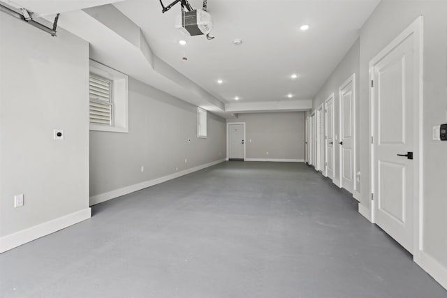 28 Cambridge Ave Unit 2, Jersey City, NJ 07307 - unfurnished bedroom featuring concrete flooring, a garage, baseboards, and recessed lighting
