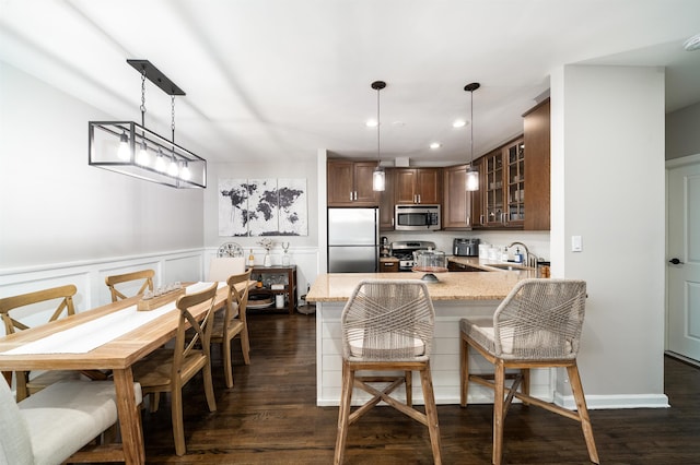 456 9th St Unit 458, Hoboken, NJ 07030 - dining space featuring recessed lighting, dark wood-style flooring, a wainscoted wall, and a decorative wall