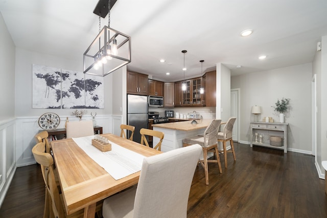 456 9th St Unit 458, Hoboken, NJ 07030 - dining area featuring recessed lighting, dark wood finished floors, and a wainscoted wall