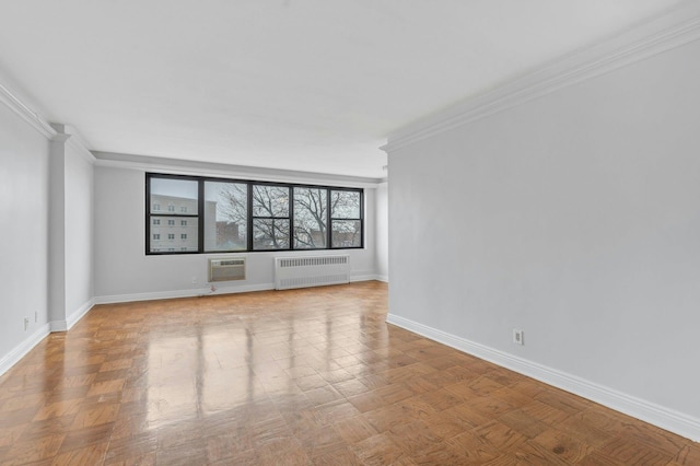 unfurnished living room featuring light parquet flooring, a wall unit AC, ornamental molding, and radiator