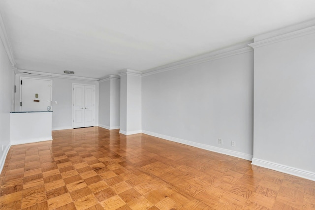 interior space with light parquet flooring and ornamental molding