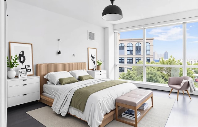 77 Hudson St Unit 1408, Jersey City, NJ 07302 - bedroom featuring wood finished floors, multiple windows, and visible vents