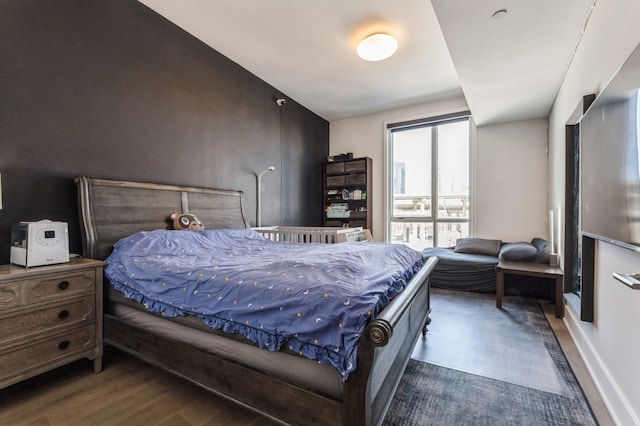 bedroom with wood finished floors