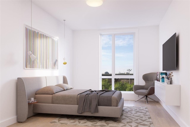 bedroom with light wood-style flooring