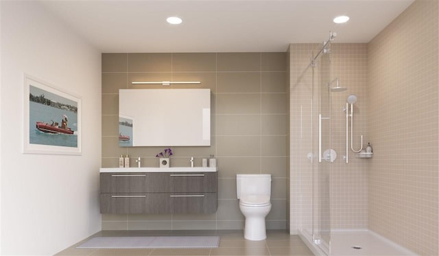 full bathroom with vanity, tile patterned floors, toilet, and a tile shower