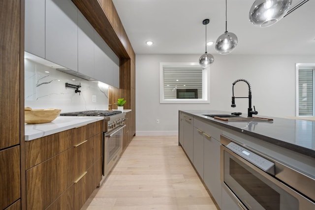 45 Graham St Unit 1, Jersey City, NJ 07307 - kitchen with appliances with stainless steel finishes, modern cabinets, light wood finished floors, and recessed lighting