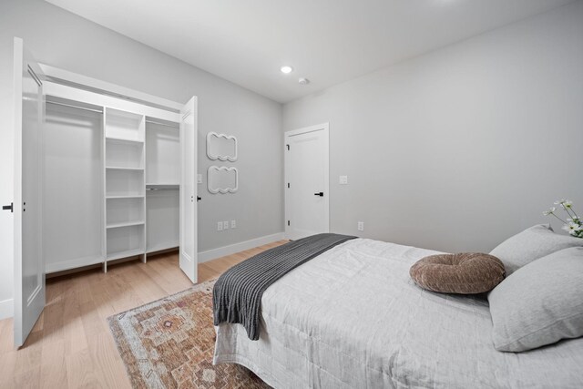 45 Graham St Unit 1, Jersey City, NJ 07307 - bedroom featuring wood finished floors, recessed lighting, and a closet