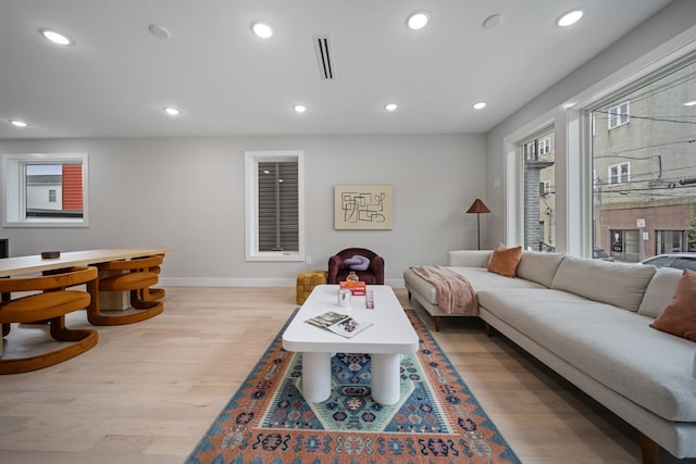 45 Graham St Unit 1, Jersey City, NJ 07307 - living area with wood finished floors, plenty of natural light, and recessed lighting