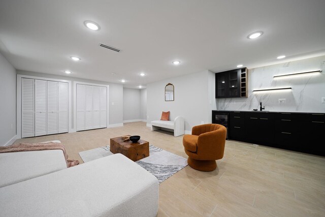 45 Graham St Unit 1, Jersey City, NJ 07307 - living room featuring wet bar, recessed lighting, and beverage cooler