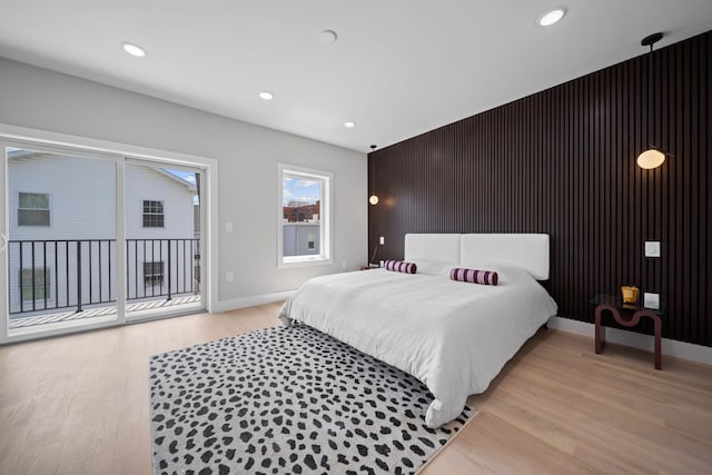 45 Graham St Unit 1, Jersey City, NJ 07307 - bedroom with access to exterior, light wood-style floors, an accent wall, and recessed lighting