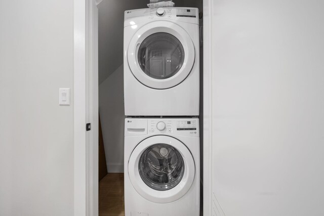 45 Graham St Unit 1, Jersey City, NJ 07307 - laundry room featuring stacked washing machine and dryer and wood finished floors