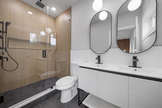 45 Graham St Unit 1, Jersey City, NJ 07307 - bathroom with double vanity, a stall shower, and tile patterned floors
