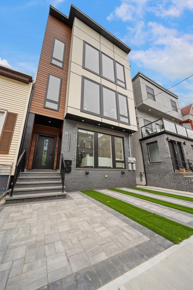 45 Graham St Unit 1, Jersey City, NJ 07307 - view of front of house with entry steps and brick siding