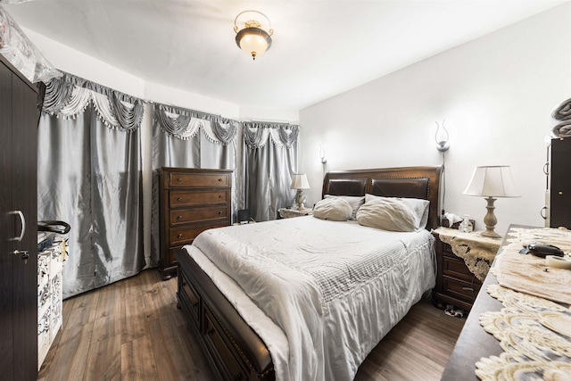 bedroom featuring wood finished floors