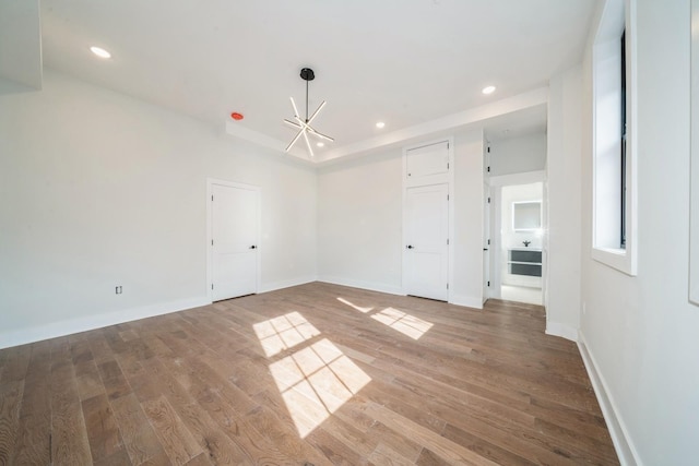 545 Palisade Ave Unit 2, Jersey City, NJ 07307 - unfurnished room with wood finished floors, a chandelier, recessed lighting, and baseboards