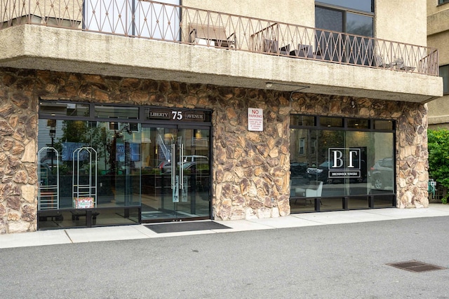 doorway to property with a balcony