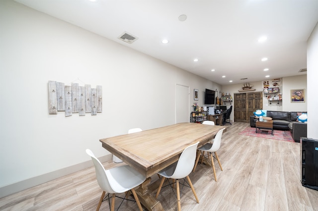 dining area featuring light wood-type flooring