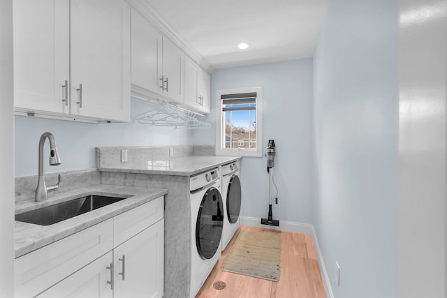 183 Oak Ave, River Edge, NJ 07661 - washroom featuring independent washer and dryer, cabinet space, light wood-style flooring, baseboards, and recessed lighting