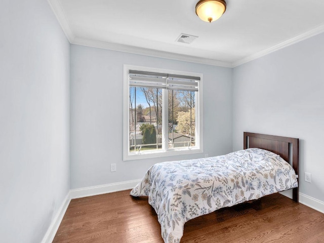 183 Oak Ave, River Edge, NJ 07661 - bedroom with wood finished floors, baseboards, and crown molding