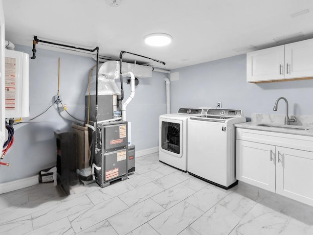 183 Oak Ave, River Edge, NJ 07661 - washroom featuring washing machine and dryer, cabinet space, light marble finish flooring, heating unit, and baseboards