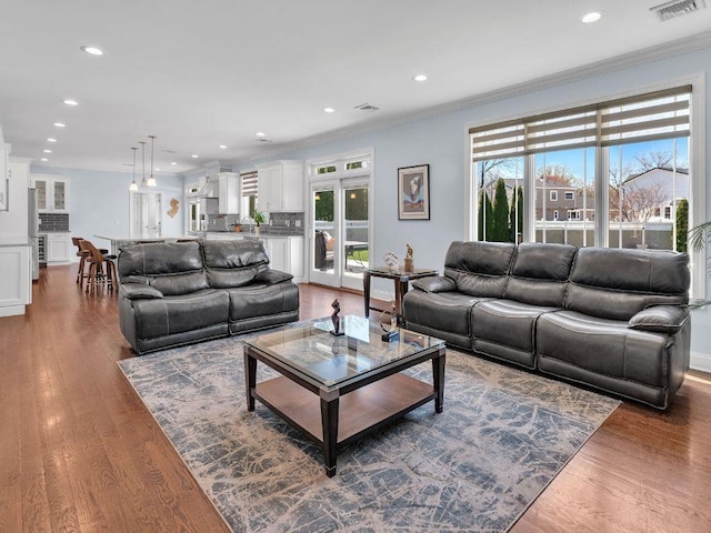 183 Oak Ave, River Edge, NJ 07661 - living room with ornamental molding, recessed lighting, and wood finished floors