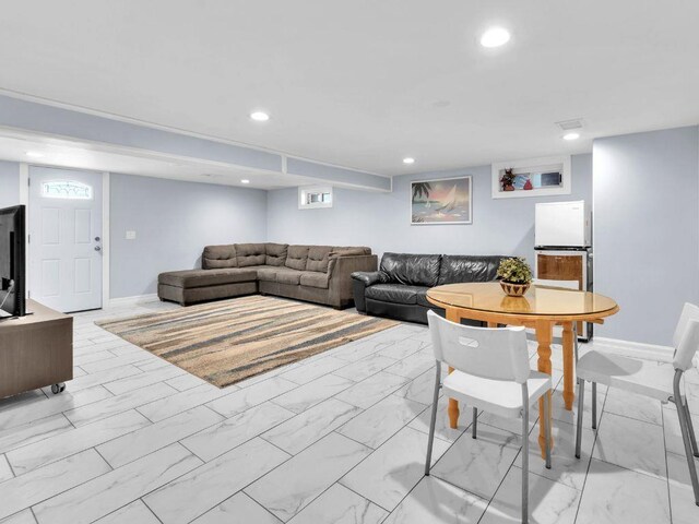 183 Oak Ave, River Edge, NJ 07661 - living room featuring baseboards, light marble finish floors, healthy amount of natural light, and recessed lighting