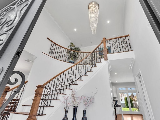183 Oak Ave, River Edge, NJ 07661 - stairway with a high ceiling, a chandelier, recessed lighting, and ornamental molding