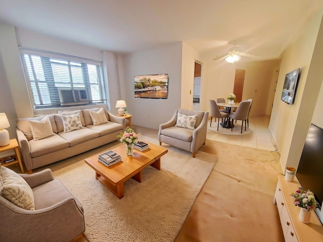 living room featuring light tile patterned floors and ceiling fan